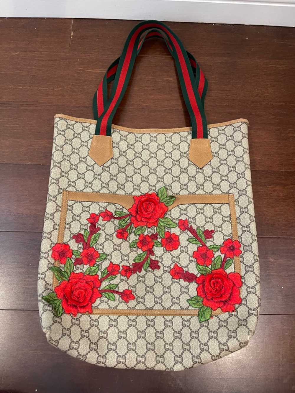 upcycled brown coated canvas tote with red and green stripes strap